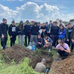 Professor Dmytruk and his students digging a pit to assess the soil properties and determine soil identification using LandPKS Soil ID in Ukraine.